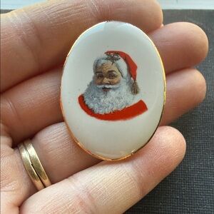Vintage porcelain Santa Claus cameo brooch marked Japan